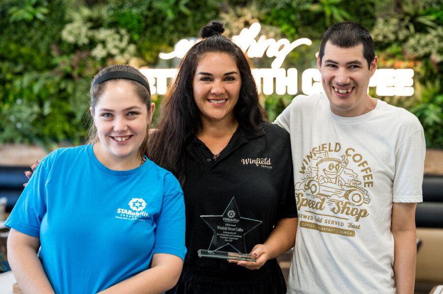 Alexis Kypriotes, STARability participant; Jeanette Donatti, Winfield Street Coffee co-owner; Dago Romero, STARability participant.
